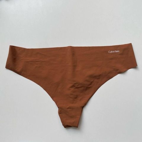 Трусики-стринги женские бесшовные Calvin Klein коричневые vk9-ki0-kjm фото