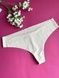 Трусики-стринги женские бесшовные Calvin Klein молочные aix-0np-47r фото 1